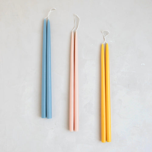 Our Blossom Dipped Taper Set combines our favorite spring hues into the perfect bundle. Display the colors together or separately.   Set includes: one pairs of petal, heron & saffron 18" dipped taper candles.   Our tapers are crafted to burn drip-free at a rate of approximately 1 hour per inch. Each candle is dipped 35 times for a superior depth of color, and pairs are joined by a braided cotton wick for the cleanest burn.