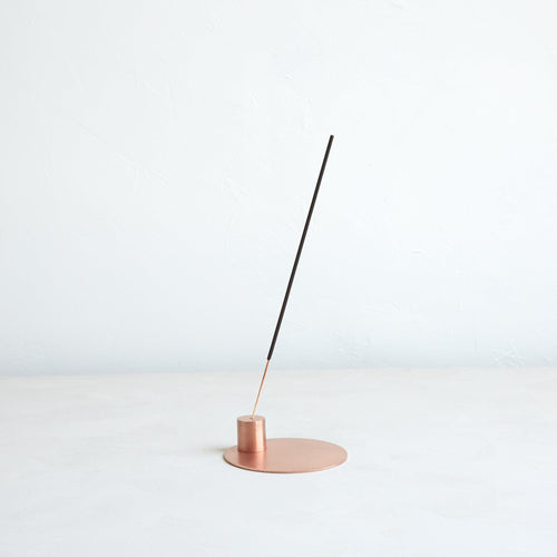 This copper incense holder is the perfect companion to our essential oil incense. Its wide base collects falling ash and the simplistic design proves to be an ideal accent piece to any space. Made of copper plated iron and hand finished—slight variations may occur.