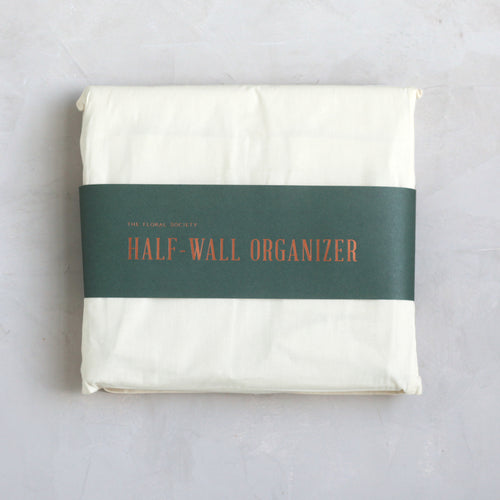 Our half-wall organizer features 20 durable compartments in a variety of sizes to accommodate a multitude of supplies. Made of heavy-gauge cotton canvas with copper rivets, this versatile design will look great while tidying your workshop, kitchen, closet, or playroom.