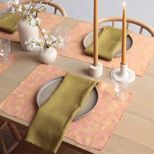 The No. 1 Botanical Placemat & Napkin Set features perfectly paired, handmade, botanically dyed linen napkins and placemats to add to your seasonal table. The placemats are dyed with quebracho rojo (a dense hardwood from Argentina) and then layered with pomegranate rind. Napkins are first dyed with Osage (an American hardwood tree) and transformed with the addition of iron. Pair with your favorite Floral Society candles for a complete tablescape.  Set includes 4 placemats & 4 napkins. 
