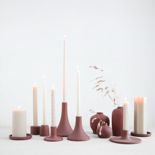 Our ceramic grand taper holders offer a fresh variation in shape and size and boast a clean, matte finish. With stand-alone appeal, they also feel dynamic as a collection. Each holder is sized to fit a standard taper candle. Due to the hand finished nature of this product, slight form variations may occur.