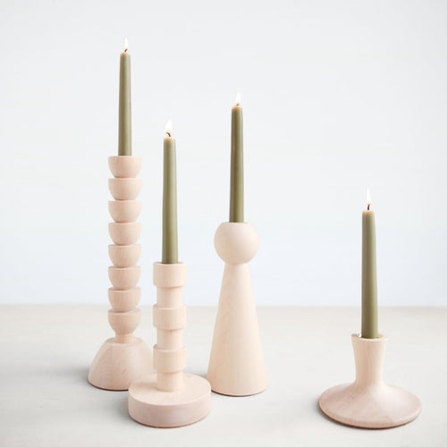 The Franc Candle Holder is hand turned in Lostine's small wood shop in Pennsylvania. This striking architectural design is made from maple wood and the perfect accent to any tablescape or mantle.  Each candle holder has a brass insert and pairs perfectly with our taper candles. Handmade in USA.