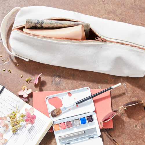 This canvas utility pouch is well-constructed and a unique size , making it a perfect fit for items both large and small—tools, travel essentials, or even a bottle of rosé for a picnic.