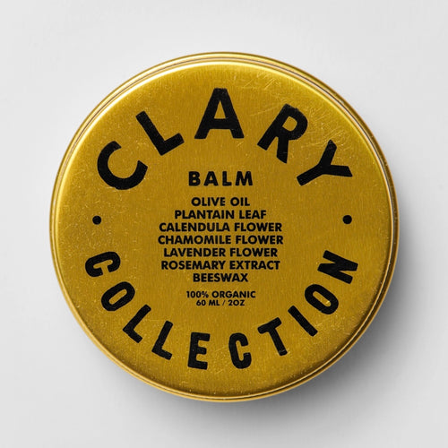 Gold container lid with 'Clary Collection' branding and product details on a white background