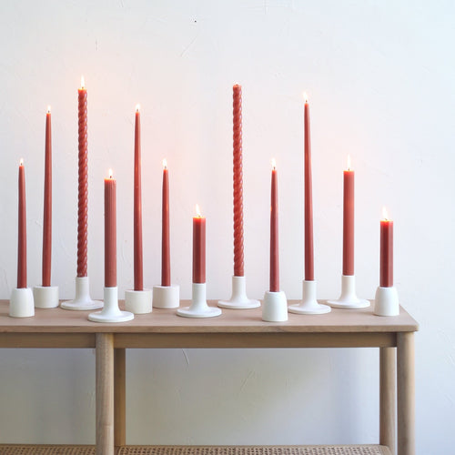 Our Clay Taper Set combines all of our clay-hued taper candles into the perfect bundle. Display the sizes and shapes together or separately.   Set includes: one pair of clay 12" and one pair of clay 18" dipped taper candles. One pair of 18", one pair of 10" and one pair of 6" Fancy Taper Candles.   Dipped Taper Candles are made of high grade paraffin wax in the United States. Fancy Taper Candles are made of high grade paraffin wax in Vietnam.  