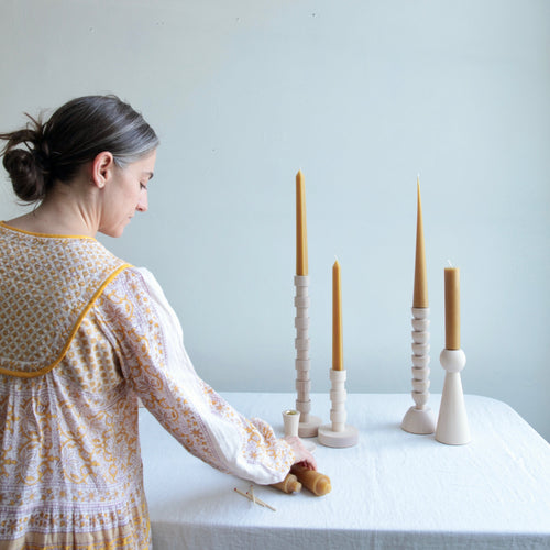 The Bella Candle Holder is hand turned in Lostine's small wood shop in Pennsylvania. This approachable, modern design is created with maple wood.  Each candle holder has a brass insert and pairs perfectly with our taper candles. Made in USA.