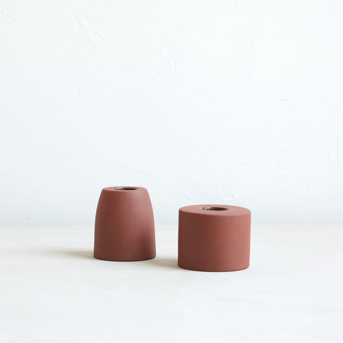 The petite ceramic taper holders complement our taper candles with their matte finish and modern form-a bold collection perfect for everyday use or entertaining. Each holder is sized to fit a standard taper candle.