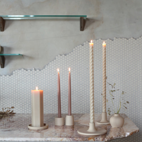The petite ceramic taper holders complement our taper candles with their matte finish and modern form-a bold collection perfect for everyday use or entertaining. Each holder is sized to fit a standard taper candle. Dinner candle holder