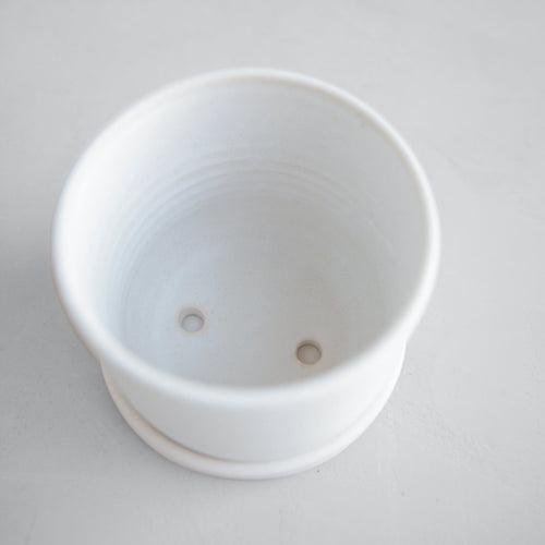 Designed in collaboration with Grandmont Street, by ceramicist Julia Finlayson in Evanston, Illinois. Julia's work focuses on minimal, yet expressive forms with unexpected glazes and textures. Each piece is unique and slight imperfections are a feature to be celebrated. 