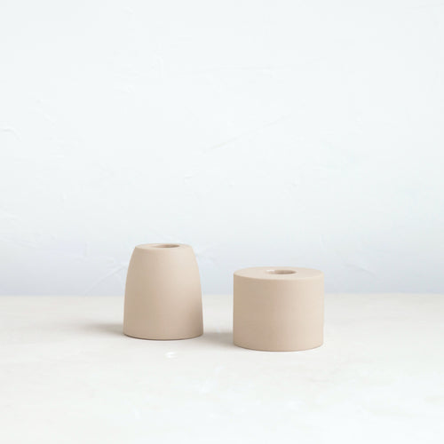 The petite ceramic taper holders complement our taper candles with their matte finish and modern form-a bold collection perfect for everyday use or entertaining. Each holder is sized to fit a standard taper candle.