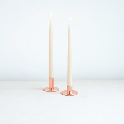 The perfect companion to our taper candle collection, our copper taper holders are a sleek, modern way to add a lustrous accent to any space. Each copper plated holder is sized to fit a standard taper candle.