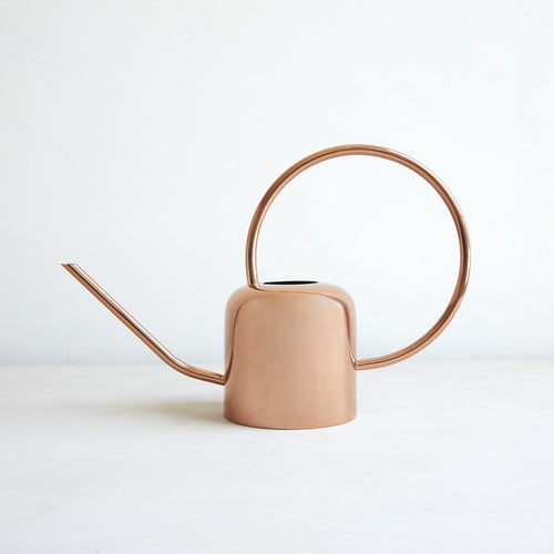 This durable, copper watering can is an essential tool for all indoor and outdoor gardening tasks. The design is both modern and functional with an east-to-grip, curved handle and an extended spout. Made of copper-plated stainless steel. Copper may darken over time as natural patina develops. Oxidation will occur more quickly if used and stored outdoors.