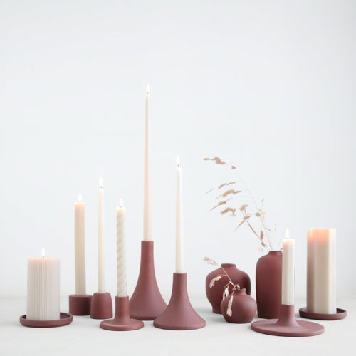 This ceramic plate is the perfect companion to our fancy pillar candles. Its wide base provides a safe surface to burn candles and the simplistic design proves to be an ideal accent piece to any space. Makes a great jewelry catchall too. Slight variations may occur.