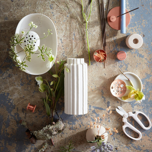 Our ceramic cylinder vases invite you to reconnect with the wild bounty of nature, providing the perfect vessels for a foraged handful or a farmer’s market bunch. Inspired by organic linear forms found in nature, use them for impromptu and loose arrangements or for displaying dried botanicals through the colder months.