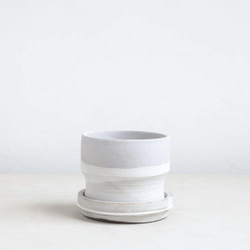 Designed in collaboration with Grandmont Street, by ceramicist Julia Finlayson in Evanston, Illinois. Julia's work focuses on minimal, yet expressive forms with unexpected glazes and textures. Each piece is unique and slight imperfections are a feature to be celebrated. This is the perfect planter for your favorite houseplant.