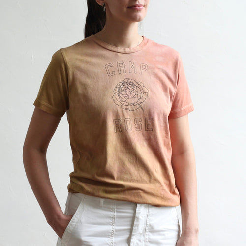 We collaborated with our friend, Anne-Marie, of Pirtti, to naturally dye our flower camp t-shirts using her signature plant dying process. Each t-shirt in this limited edition run is bound with string before being submerged in the dye bath. The color must seek out the fabric to adhere to it, resulting in an organic pattern of color that ebbs and flows in depth.