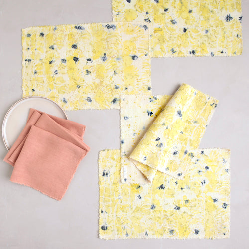 The No. 2 Botanical Placemat & Napkin Set features perfectly paired handmade, botanically dyed linen napkins and placemats to add to your seasonal table. The placemats are dyed with leftover roses and scabiosa from our floral studio, Poppies & Posies. Napkins are dyed with cutch. Pair with your favorite Floral Society candles for a complete tablescape.  Set includes 4 placemats & 4 napkins. 
