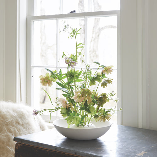This timeless piece has a built-in “frog” to help stems stand at attention, making it ideal for displaying large blooms along with herbs or foliage.