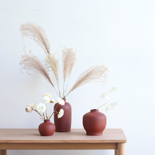 We gathered some of our favorite items so you can set your table with ease, gift thoughtfully, and effortlessly curate a nature inspired home.   Take the guess work out of setting your table this holiday season with the Blossom Vase Set in Earth.   Set Includes: Three ceramic blossom vases 