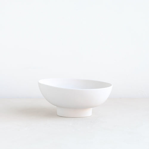 Designed for low lush arrangements, the ceramic compote is our take on the quintessential centerpiece vessel. Slip cast by hand for a seamless finish, its oval ceramic body inspires a natural and organic style of arrangement. When not containing flowers it can also be used as a catch-all, a fruit bowl or as a sculptural object. Food, Microwave, dishwasher and oven safe.